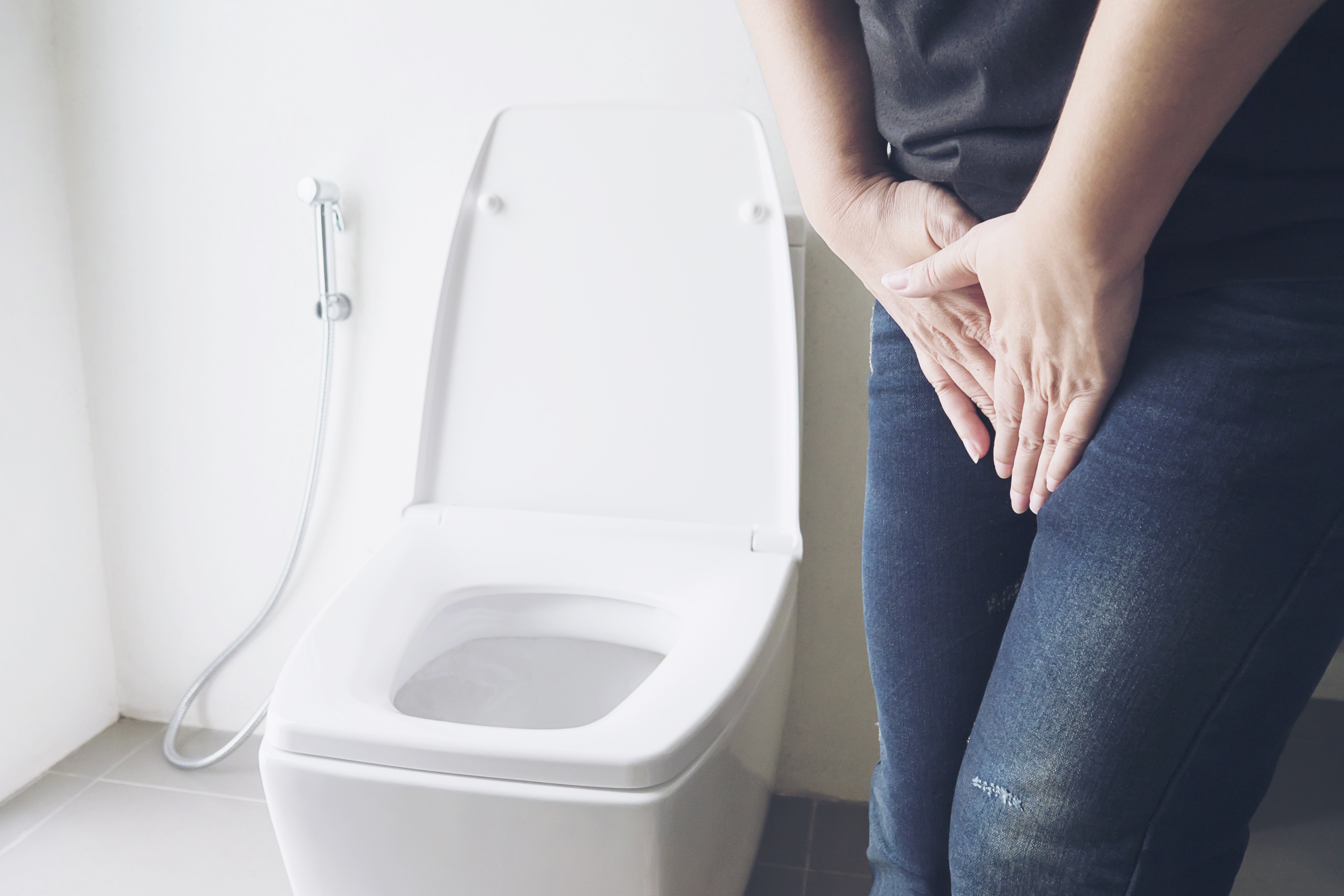 woman-holding-hand-near-toilet-bowl-health-problem-concept.jpg